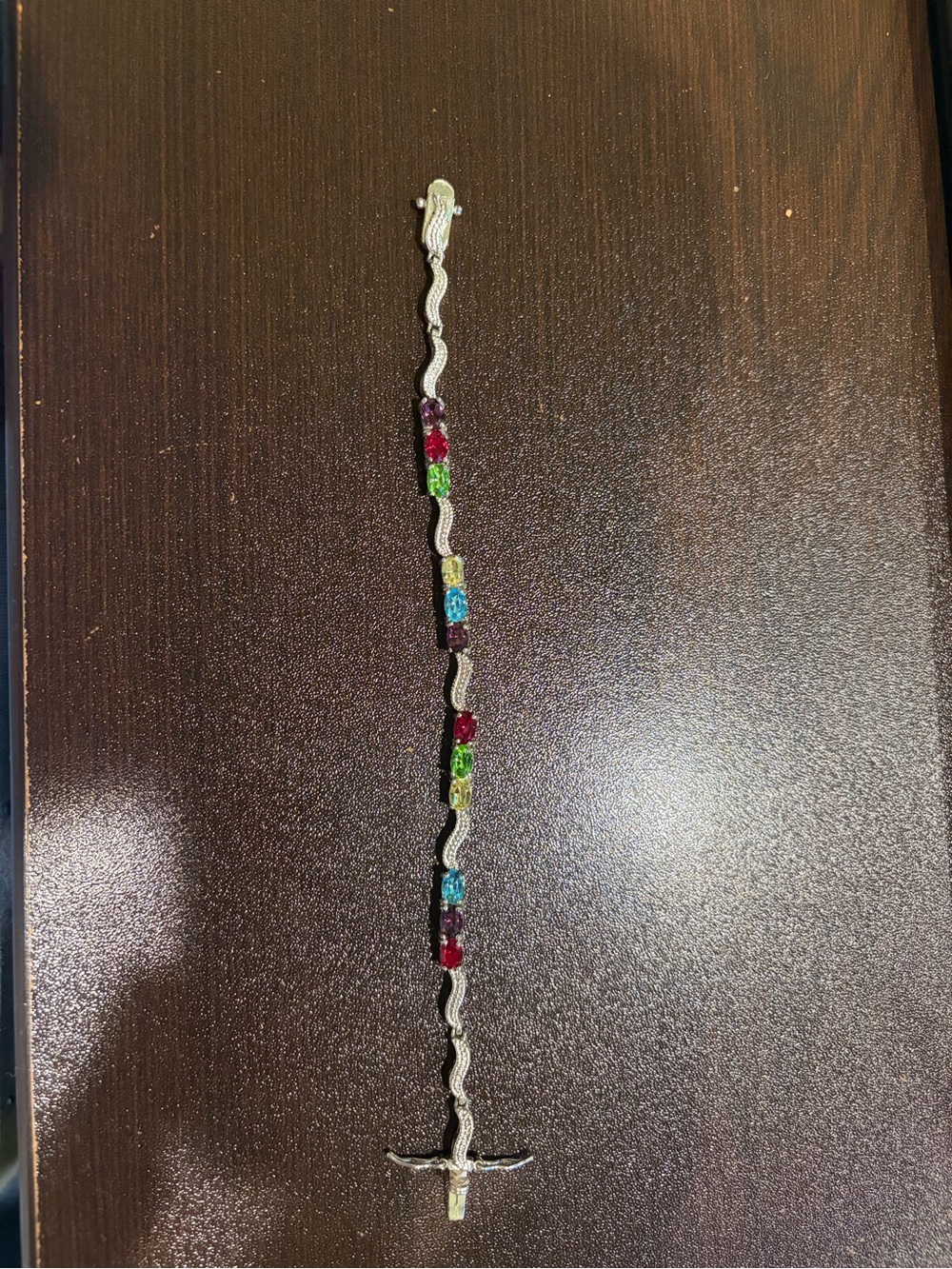 Beautiful Silver Tennis Bracelet with Multicolor Gem Accents.